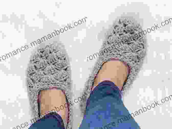 A Pair Of Crocheted Hour Slippers In Vibrant Blue Yarn, Showcasing The Detailed Stitches And Cozy Design. Easy To Crochet 2 Hour Slippers